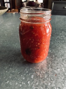Filled jar of tomatoes