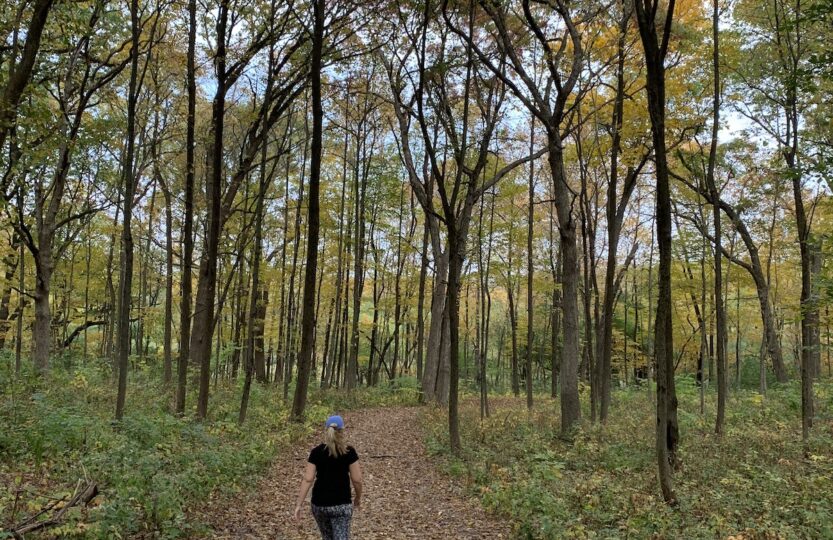 Liz walking in the woods