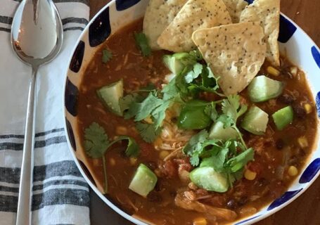 tortilla-soup-turkey in bowl with napkin and spoon